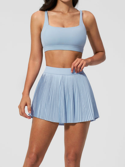 Tenniskleid mit überkreuzten Trägern und Faltenrock