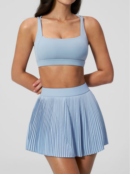 Tenniskleid mit überkreuzten Trägern und Faltenrock