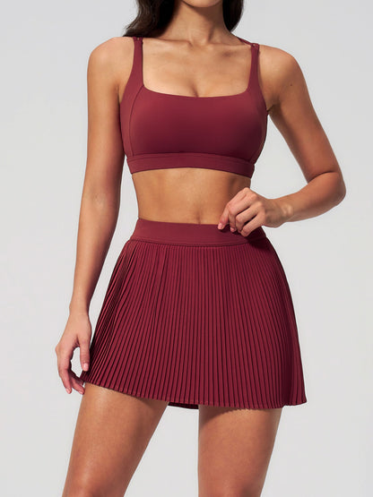 Tenniskleid mit überkreuzten Trägern und Faltenrock