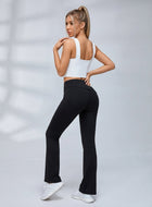 Crisscross Halter Neck Hollow Out Crop Top Ruched Waist Flare Leg Yoga Tracksuit